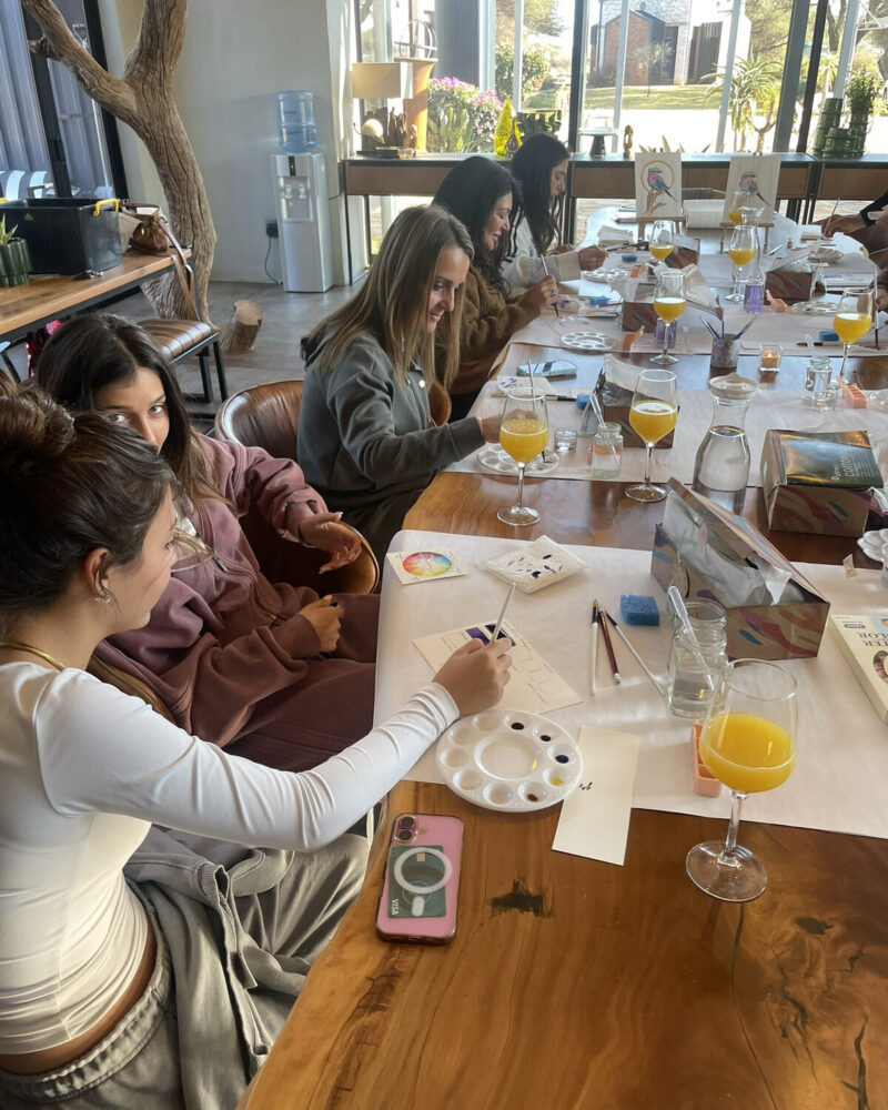 Participants seated together around a workshop table.